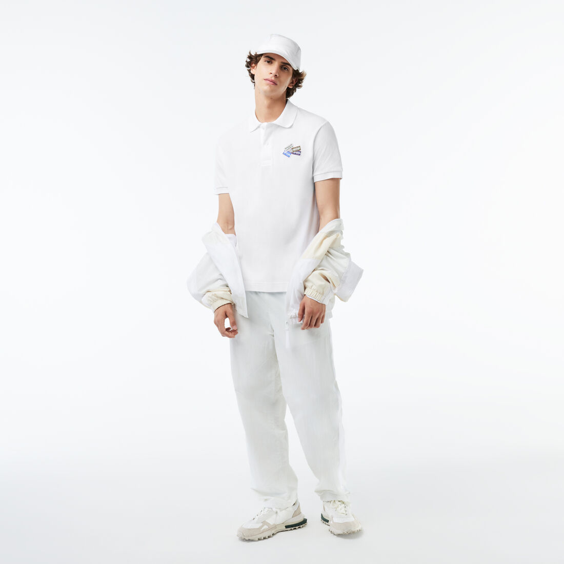 تي شيرت بولو بطبعة رقع بلونين من مجموعة Original L.12.12 تي شيرت بولو بطبعة رقع بلونين من مجموعة Original L.12.12