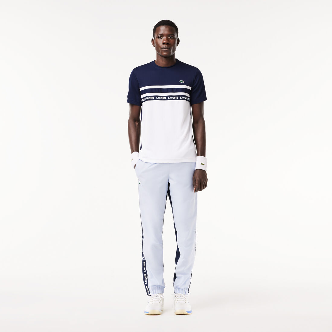 تي شيرت تنس بيكيه مخطط بشعار فائق الجفاف تي شيرت تنس بيكيه مخطط بشعار فائق الجفاف