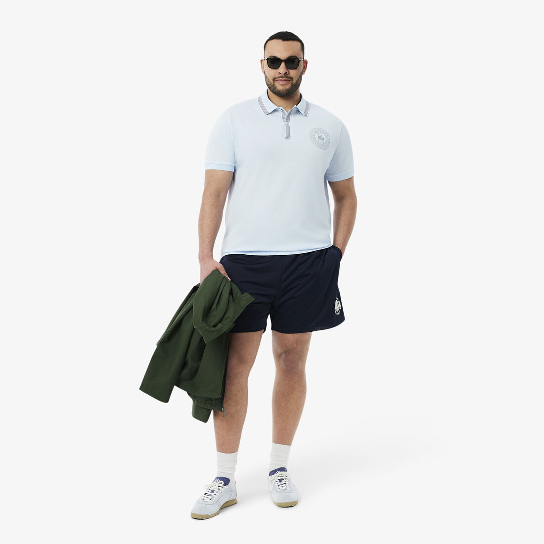 قميص بولو ذو قصة عادية L.12.12 بطبعة شارة قميص بولو ذو قصة عادية L.12.12 بطبعة شارة