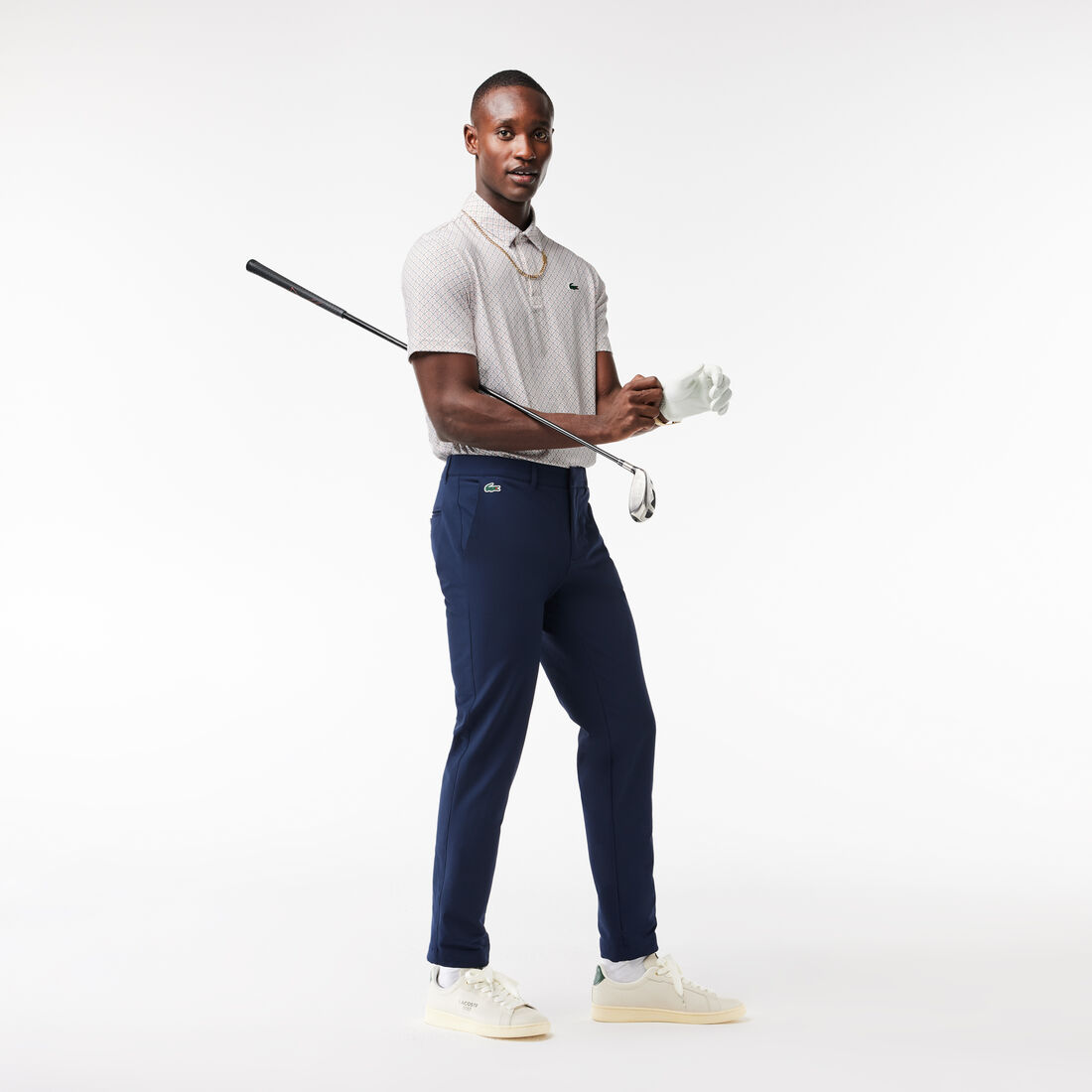 تي شيرت بولو قطن مطاطي بقصّة عادية ومزين بشريط يحمل كلمة Lacoste تي شيرت بولو قطن مطاطي بقصّة عادية ومزين بشريط يحمل كلمة Lacoste