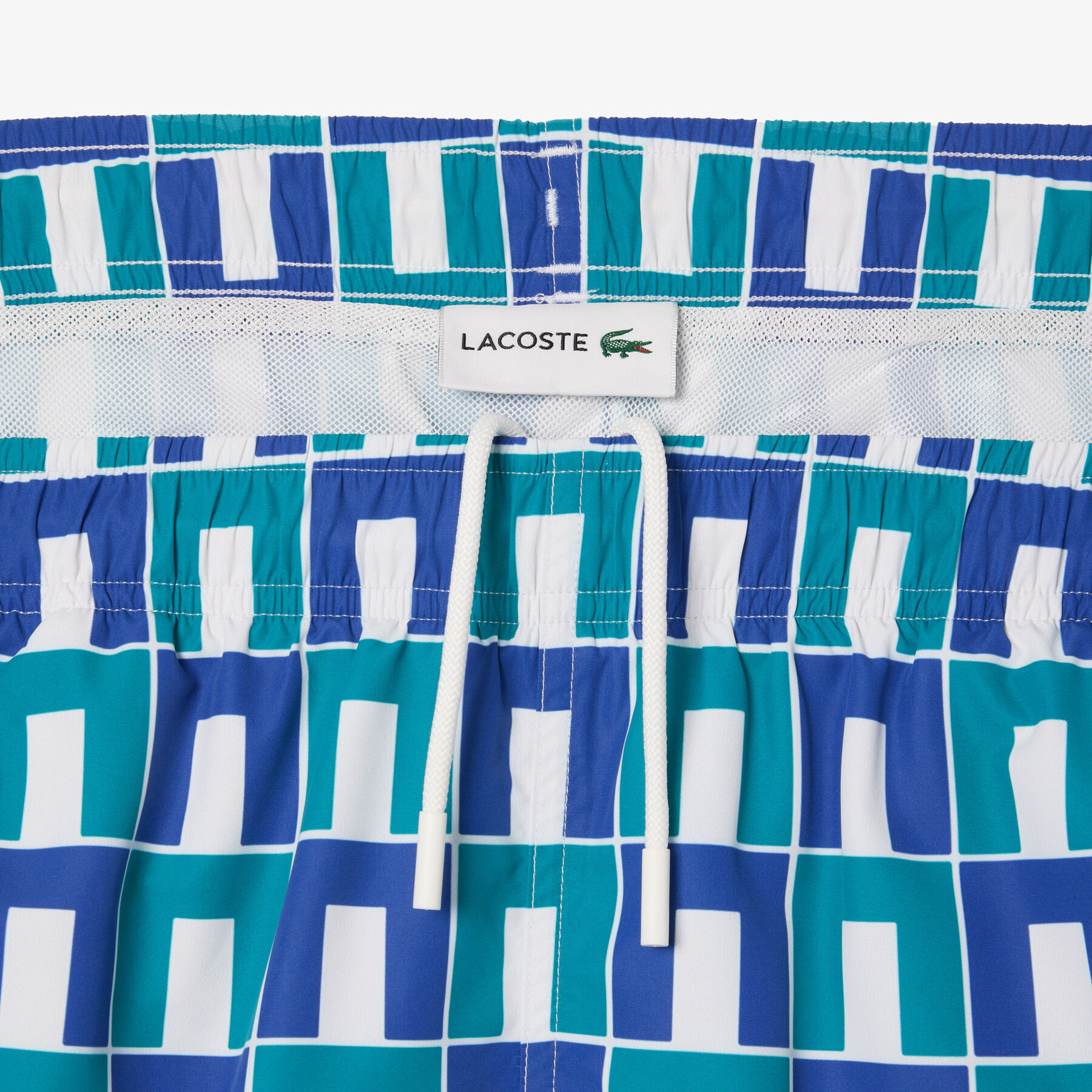 lacoste mid length robert george print swim trunks