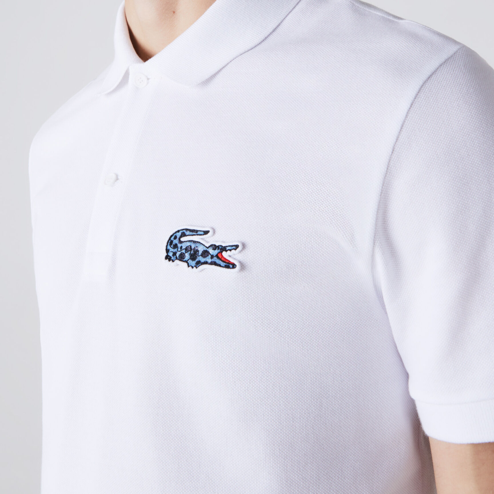 تيشيرت بولو قطن بيكيه عضوي للرجال مجموعة Lacoste x National Geographic تيشيرت بولو قطن بيكيه عضوي للرجال مجموعة Lacoste x National Geographic