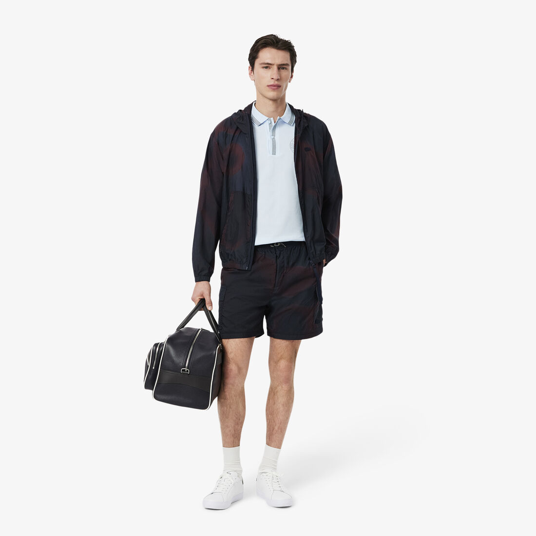 قميص بولو ذو قصة عادية L.12.12 بطبعة شارة قميص بولو ذو قصة عادية L.12.12 بطبعة شارة